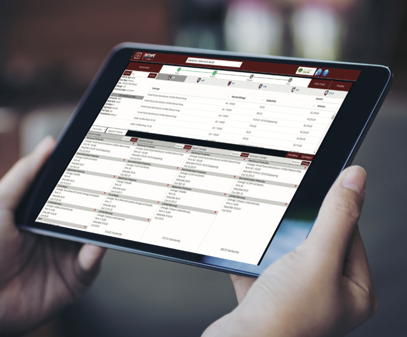 Hands holding tablet displaying spreadsheet with financial data, product listings, and pricing information in organized columns and rows.