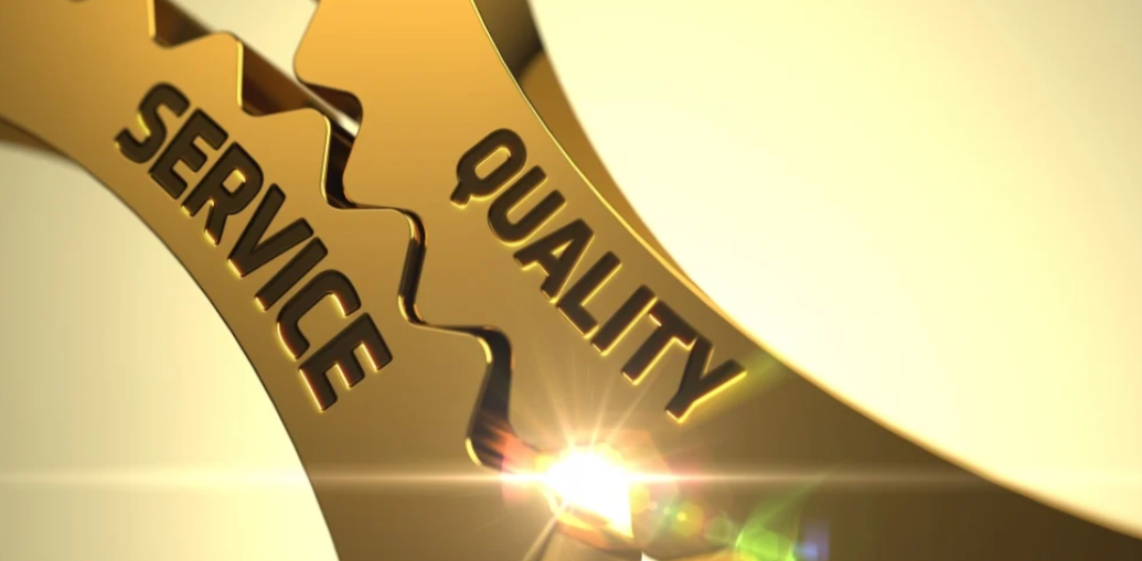 Two interlocking gold gears with "SERVICE" and "QUALITY" text, bright light shining from the center connection point against a soft yellow background.